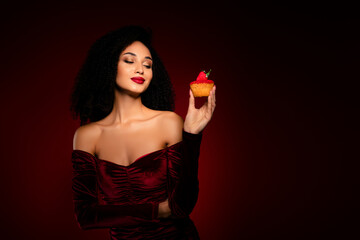 Chic fancy lady hold berry muffin looking feel tempting wearing silky dress gown