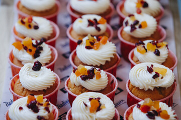 Delicious Cupcakes with Cream and Fruit Toppings