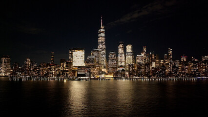 Obraz premium Night Skyline Of New York Skyline At Manhattan In New York United States. Night City Landscape. Financial District. New York Skyline At New York United States. Highrise Buildings Scenery. 