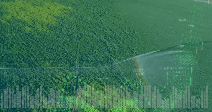 Center pivot irrigation sending water across crop field, overlaying floating charts and data