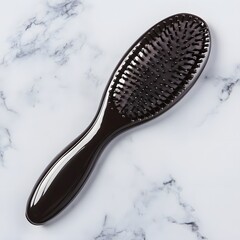 Sleek Black Paddle Hairbrush on Marble Background