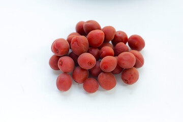 Umeboshi, Japanese pickled plums, Sour and salty taste.