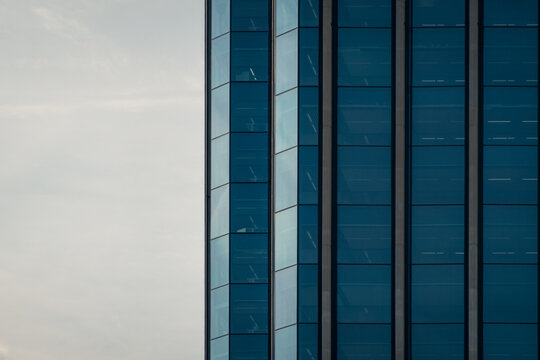 Modern blue glass facade of a building in Colon City, Panama