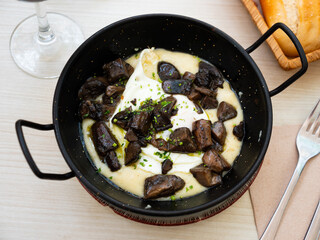 Nice portion of eggs with mushrooms served in potato casserole