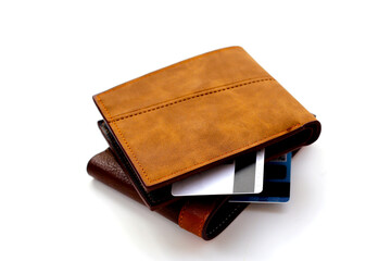 Black wallet with credit card on white background.