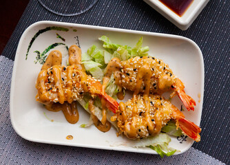 Fried shrimp with sesame seeds. Japanese cuisine. High quality photo