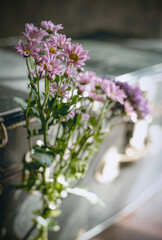 Dusty vintage black suitcase with flowers inside