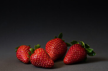 Fresh Ripe Strawberries on Dark Background