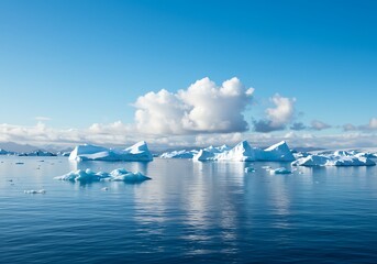 Icebergs floating on water under a cloudy sky