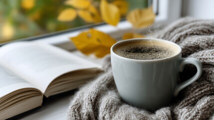 Cozy autumn morning with coffee and book