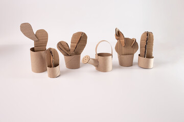 a paper cutout garden, cactus, cardboard, a group of recycled crafts sitting next to each other,
