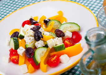 Delicious salad with tomatoes, cucumber, feta cheese and paprika. High quality photo
