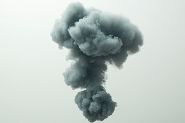 A  grey, fluffy, cloud-like ink bloom suspended in the air.