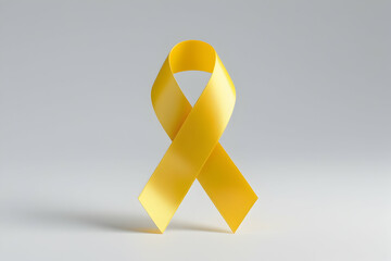 Elegant Yellow Awareness Ribbon Isolated on White for Support and Hope Concepts: Symbol of Solidarity and Various Causes Imagery: Yellow, Ribbon, Awareness, Isolated, White, Support, Hope, Solidarity.