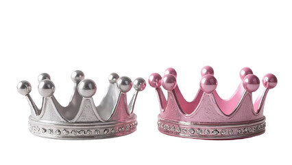 Two ornate crowns, one silver and one pink, sit side-by-side against a transparent background.  Each crown features small, round accents and a decorative band of rhinestones.