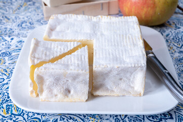 French squared pont l'eveque cow cheese from Calvados department, Normandy, France