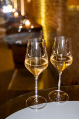 Visit of wine cellar, tasting of brut champagne sparkling wine produced by traditional method in underground caves close up