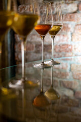 Visit of wine cellar, tasting of brut champagne sparkling wine produced by traditional method in underground caves close up