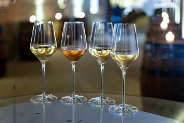 Visit of wine cellar, tasting of brut champagne sparkling wine produced by traditional method in underground caves close up