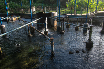 Central water distribution tank with pipes to destination villages
