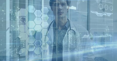 Male doctor standing behind glass panel in medical lab, with holographic hexagon data interface - Powered by Adobe
