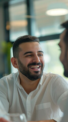 Obraz premium Authentic Portrait of a Man in his Early 30s, Joyful Expression, Close-Up, Smiling, Dark Hair, Short Beard, Wearing a Light-Colored Button-Down Shirt