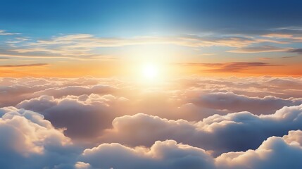 Fototapeta premium Majestic aerial view above white fluffy clouds during golden sunset with bright sun and dramatic orange sky. Peaceful cloudscape scenery for spiritual concepts.