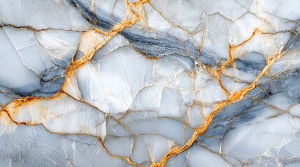 Close-up view of striking light gray and white stone surface with gold veins.