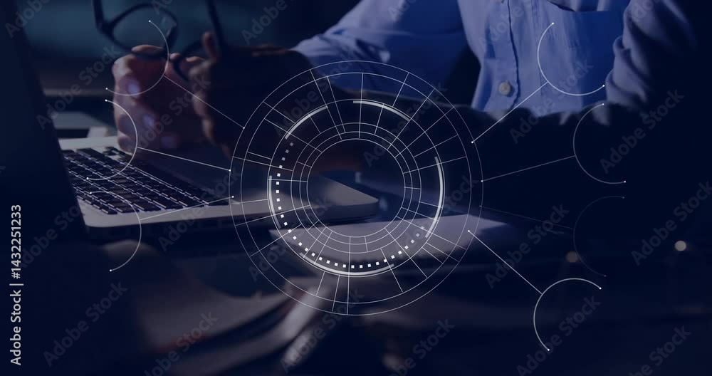 Poster man typing at desk in modern tech workspace, showing circular hud overlay and cables
