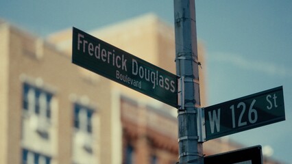 Fototapeta premium Street signs indicating Frederick Douglass Boulevard and West 126th Street in Manhattan, New York City