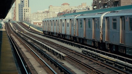 Obraz premium Subway train arriving at an elevated station in Manhattan, New York City, USA