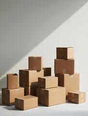 Stack of cardboard boxes in various sizes arranged on a white surface in natural light, ideal for shipping, packaging, moving, storage, and delivery logistics visuals


