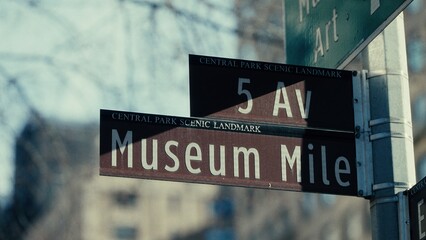 Brown street sign indicating Museum Mile and 5th Avenue, a Central Park scenic landmark in Manhattan, New York City