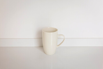 Minimalist Cream Ceramic Mug on White Background