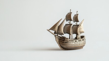 Obraz premium Antique-style ship model on a plain background