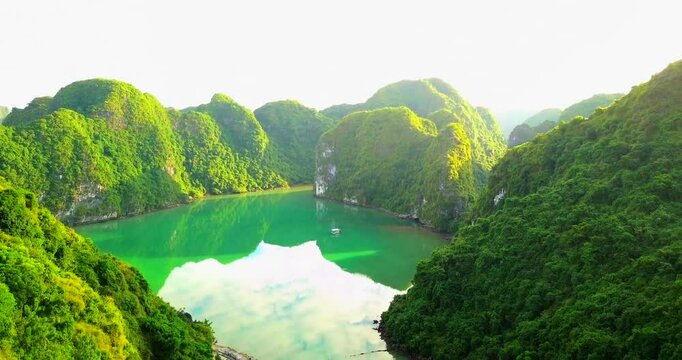 Dreamy sunset landscape Halong Bay, Vietnam view from adove. This is the UNESCO World Heritage Site, a beautiful natural wonder in northern Vietnam. Vietnam halong bay. Island in the sea. Drone 