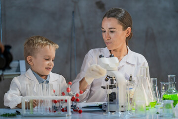 A young scientist and a child conducting an experiment in a laboratory. Encouraging curiosity, STEM...