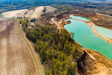 Sand quarry development near farm fields, aerial view
