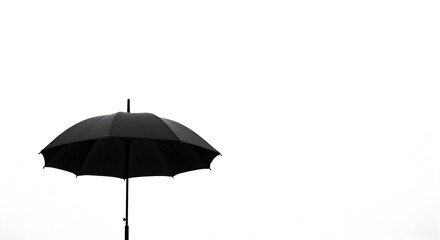 Lone Black Umbrella Against White Sky For Minimalist Weather Design