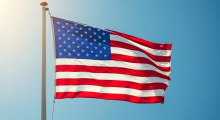 Obraz premium Memorial Day - A low angle shot of the american flag waving proudly against a clear blue sky on a sunny day