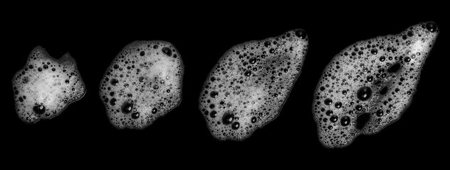 Top view set white foam soap isolated on a black background. concept of shampoo bubble, suds texture bathtub. shaving cream gel, bath lather. foam bubble