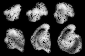 Top view set white foam soap isolated on a black background. concept of shampoo bubble, suds texture bathtub. shaving cream gel, bath lather. foam bubble