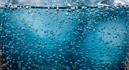 Refreshing Effervescence: Bubbles Floating Through an Icy Turquoise Liquid
