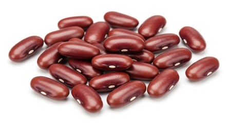 A scattered pile of kidney beans on a white surface showing their smooth texture and shape detail well