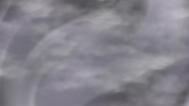 Grey gradient smoke produces a dreamy backdrop with blurry gray clouds, perfect for abstract backgrounds or conveying a surreal atmosphere.
Hazy grey smoke in a gradient blend forms misty clouds, ide