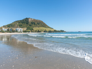 Landmark Mount Maunganui at end of long sandy beach