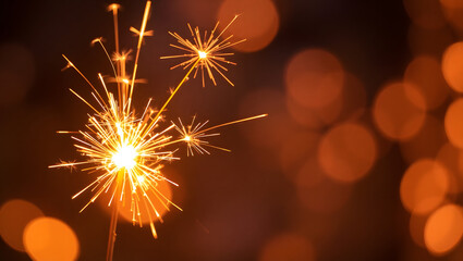 Close-up of Sparkling Sparklers Glowing with Golden Light