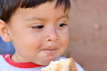 Little latin boy. Poverty concept.