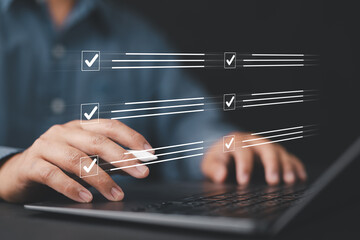Digital to do list system displayed over man working on laptop, focusing on productivity, task...