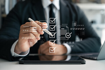 Business checklist management and performance tracking, businessman using laptop with digital...